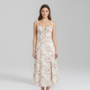 Chic Midi Dress with Patterned Skirt and Adjustable Shoulder Straps